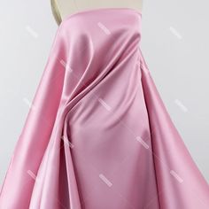 the back of a pink dress on a mannequin