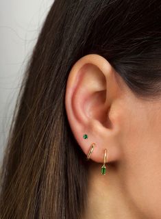 "The tiniest little studs for the most understated sparkle. Simple and dainty, they're perfect for layering with other dainty hoops and studs when you have multiple piercings. ∙ Available with emerald green, blue or purple cz stones. All options are available on the dropdown menu. ∙ Sold individually (1 stud) or by pair (2 studs) PLEASE NOTE - These are very tiny. * D E T A I L S * ∙ Material:  .925 Sterling Silver or 18K Gold Plated over .925 Sterling Silver  ∙ Stone: Green, Blue or Purple cz s Stacked Lobe Ear Piercings Simple, Two Hole Earring Ideas, Earring Two Holes, Three Ear Lobe Piercings, Blue Ear Piercings, Third Hole Piercing, Minimalist Huggie Birthstone Earrings, Minimalist Birthstone Huggie Earrings, Minimalist Everyday Huggie Earrings With Birthstone