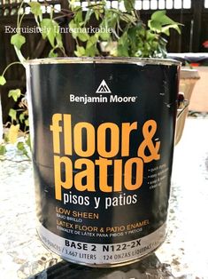 a can of floor and patio paint sitting on top of a table