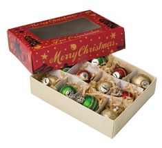 an open christmas box filled with ornaments