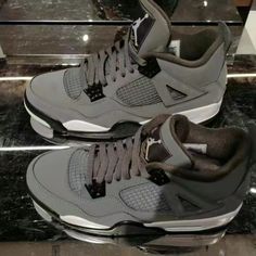 The Appearance Of The Shoes Is Largely Made Of Grey Bulbar Leather. The Buckle On The Side Of The Shoe Is The Same Gray Color As The Shoe Body. The Toe Of The Shoe Is Also Made Of Grey Suede Material, And The Entire Top Of The Tongue And Heel Of The Shoe Up To The Pull Piece Of The Shoe Is Also Made Of Grey. Grey Jordan 4, Jordan 4 Cool Grey, Cool Grey Color, Nike Shoes Women Fashion, Pretty Sneakers, Birthday Collage, Jordan Shoes Retro, Pretty Shoes Sneakers, Jordan 4s