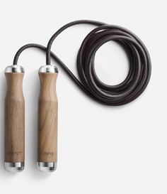 two wooden handles are attached to a leather cord that is plugged into the charger