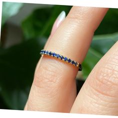 Natural Blue Sapphire Ring, 2mm Half Eternity Band, 18K Gold Ring, Blue Sapphire Band, Sapphire Wedding Band, September Blue Birthstone Ring ♥ Details Handmade to order * Ring size: US 3-10 (Please message me for sizes larger than 10 or smaller than 3 : ) * Metal: Solid 18K Gold (available in 14K and 18K White, Yellow and Rose Gold, and 950 platinum) * Total Carat Weight: 0.35 carats * Number of Stones: 19 * Stone size: 1.5mm each * Gemstone type: Natural Blue Sapphires * Gemstone Cut: Round Bri Blue Cubic Zirconia Eternity Band With Prong Setting, Blue Diamond Round Eternity Band, Blue Diamond Stackable Eternity Band, Blue Eternity Band For Promise, Blue Sapphire Eternity Band As Gift, Blue Cubic Zirconia Eternity Band Gift, Blue Sapphire Stackable Rings For Anniversary, Blue Sapphire Half Eternity Ring In Cubic Zirconia, Blue Eternity Band With Vvs Clarity For Anniversary