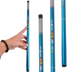 three blue pencils are being held up by a person's hand and the other one is pointing at them