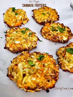 crab cakes are arranged on a sheet of paper