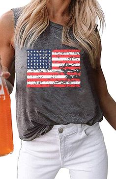 Celebrate our nation's independence with these soft, casual loose fit graphic tanks by Haute Edition. They come in several on trend colors, featuring a graphic print of the American flag. Show your USA pride and wear with your favorite jeans, shorts, and skirts this summer. The fabric is made of a soft, cozy cotton blend. This is the perfect tank for gatherings with friends, backyard BBQs, and running errands this summer. USA flag graphic Soft cotton fabric Relaxed fit 65% Cotton, 35% Polyester Usa Tank Top, American Flag Tank Top, Usa Pride, Loose Fitting Tops, Ladies Tee Shirts, Patriotic Shirts, Sleeveless Tshirt, Printed Tank Tops, Stripe Print