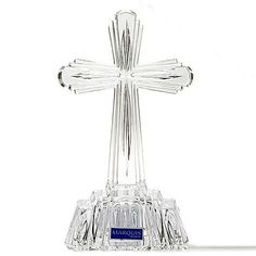 a clear glass cross on a white background