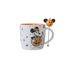 a mickey mouse mug with a pumpkin on it