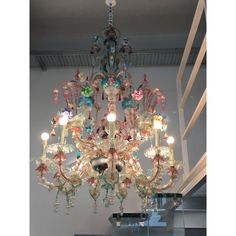 a chandelier hanging from the ceiling in a room