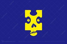 a blue and yellow puzzle piece with a skull on it's face, in the middle