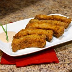 some fried food is on a white plate