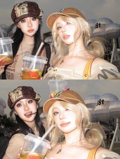 two women dressed up in costumes and hats drinking beverages from plastic cups while standing next to each other