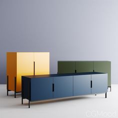 three different colored cabinets sitting next to each other