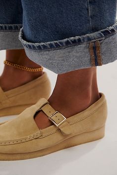 A retro classic gets a sweet touch with these suede Wallabees from Clarks, featured in their classic moccasin style with a T-bar strap for an extra dose of detail. **Features:** Slip-on style, buttery suede uppers, round toe, mocc stitching, T-bar buckle strap, natural pebble crepe rubber sole **Why We | Clarks Wallabee T-Bar Mary Janes at Free People in Tan, Size: US 8 In Style Shoes For Women, Clark Wallabees Outfit Women's, Clark Wallabees Outfit, Work Sneakers Women, Wallabees Outfit Womens, Wallabees Outfit, Clarks Wallabee, Clarks Wallabees, Moccasins Style