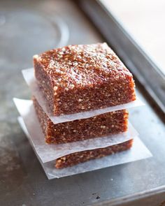 three pieces of cake sitting on top of each other in front of a window sill