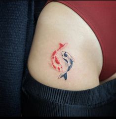 a woman with a koi fish tattoo on her stomach