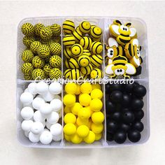 a plastic container filled with lots of different types of beads