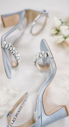 the bride's blue shoes are adorned with jewels