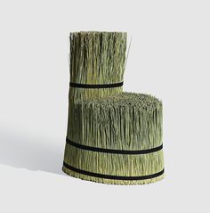 two stacks of grass sitting next to each other on top of a white flooring