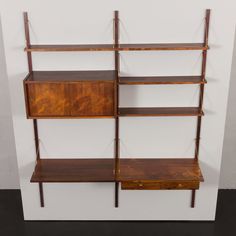 a wooden shelf with three shelves on each side