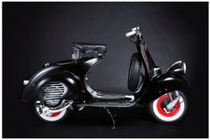 a black and red scooter is shown against a dark background with white trim