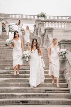 bridesmaids walking down the stairs at their wedding