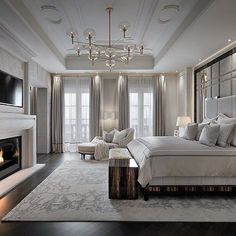 a large bedroom with a fireplace in the corner