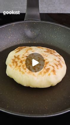 a pancake being cooked in a frying pan