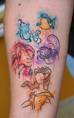 a woman's arm with some tattoos on it