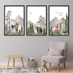 three paintings of animals in the woods on a wall above a gray chair and table