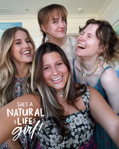 three girls are posing for the camera with their arms around each other and one girl is smiling