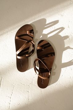 Rhodes Sandals Brown Toe Post Footbed Sandals For Vacation, Brown Footbed Sandals With Single Toe Strap For Summer, Brown Flip Flops With Removable Insole For Everyday, Everyday Brown Open Toe Flip Flops, Brown Open Toe Flip Flops For Everyday, Everyday Brown Leather Footbed Sandals, Leather Toe Post Sandals For Everyday, Brown Leather Footbed Sandals For Everyday, Leather Open Toe Flip Flops For Everyday