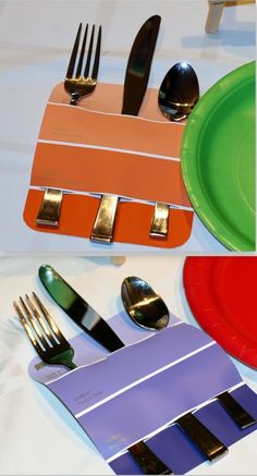 there are forks, spoons, and knives on the table with different colored plates