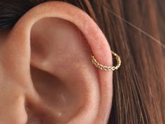 14K SOLID GOLD handmade braided single hoop earring ♦Made from SOLID 14k gold (no plating, not gold-filled). 💜 Each earring is handmade from start to finish by me in my studio 🙌🏼 ♦Perfect for a variety of piercing locations: cartilage / septum / cartilage / rook / helix / lobe ➤ Features: Select your preference in the gauge/metal/ inner hoop diameter at the top right of this page. ♦ Material: 14k solid yellow/rose gold. ♦ Choose your gauge and diameter from the drop-down menu: What is gauge? Cheap Modern Gold Cartilage Earrings, Cartilage Piercing Hoop, Piercing Locations, Helix Earrings Hoop, Septum Earrings, Gold Cartilage Earrings, Helix Ring, Nose Ring Hoop, Gold Hoop Earring