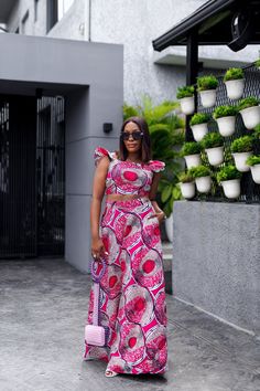 African print maxi skirt and top set. (This is sold as a 2 piece) African print cotton. Skirt length approx 45in and has a zipper. Top soft lined, with back zipper. Skirt has pockets and is unlined. Model is wearing a size  M.