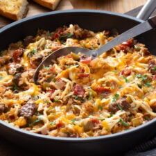 a casserole dish with meat, cheese and bread