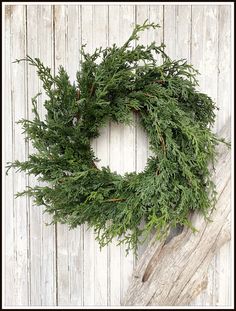 a close up of a wreath on a wooden surface