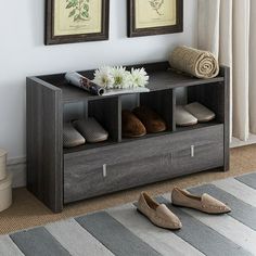 a pair of shoes sitting on top of a wooden shelf in front of a window