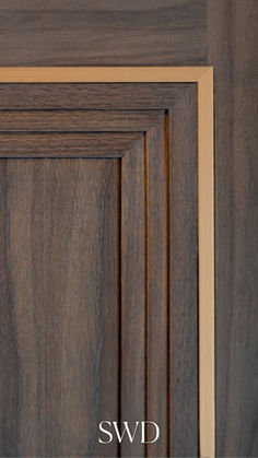 a close up view of the wood grains on a door handle and side panel