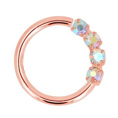 a rose gold nose ring with three crystal stones