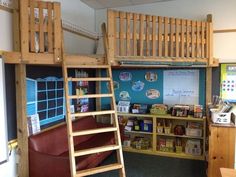 there is a loft bed with a ladder to the top and bookshelf below