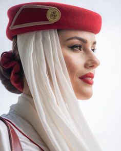 a woman wearing a red and white hat