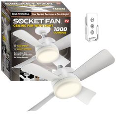 a white ceiling fan with two lights in front of a box and remote control attached to it