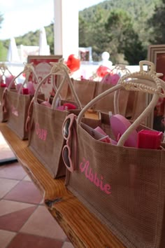 some brown bags with pink writing on them