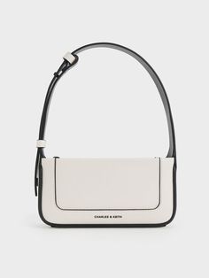 This product is made with at least 20% sustainable materials by weight. CHARLES & KEITH uses recycled, degradable, organic, and water-based materials in our eco-conscious collection. This season, the Daylla returns in a more compact and sleek silhouette that is great for casual days. Featuring the same rectangular and structured silhouette as the Daylla tote, this piece is a smaller iteration that is just nice for holding your most-used essentials. It also comes with a contrast stitch-trim detail that stands out against the cream finish. Plus, the shoulder strap is also adjustable so you can wear it as a shoulder bag or longer crossbody bag, depending on your preference. Charles And Keith Bags, Designer Bags Black, Glossier Bag, Charles And Keith, Cream Bag, Black And White Bags, Sling Bag Black, Cream Bags, Jimmy Choo Bag