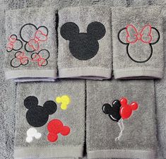 four towels with mickey mouse designs on them