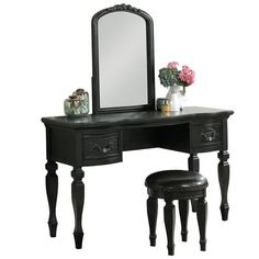 black vanity with stool and mirror on white background