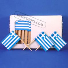 three matches with flags on them are in a box