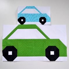 a piece of paper with a green car on it, cut out and glued to the side