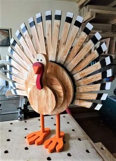 a wooden turkey sitting on top of a table